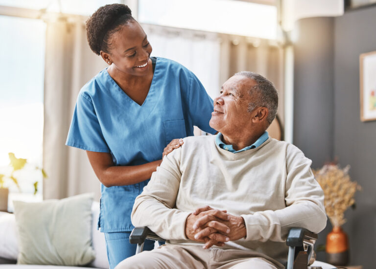 elderly man with caregiver at home
