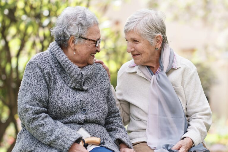 two elderly friends at a park
